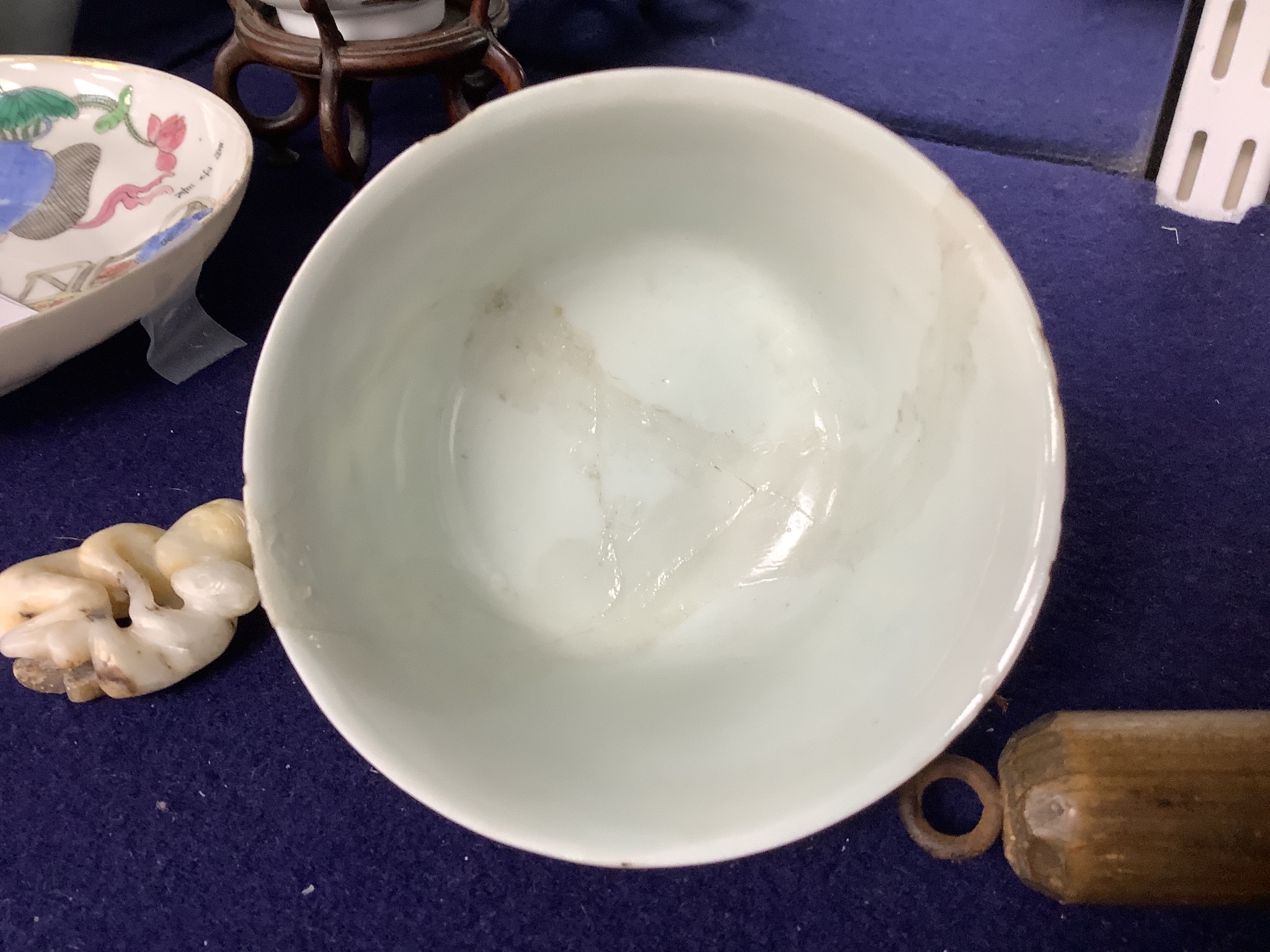 A 19th century famille rose bowl and stand, a blue and white cup, a famille rose jar and a stone carving of two monkeys